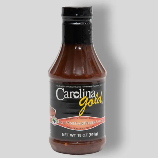 A single bottle of Carolina Gold BBQ sauce on a neutral background.