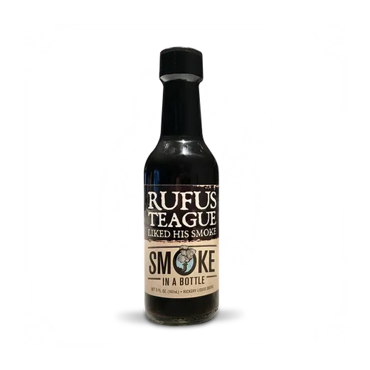 A bottle of Rufus Teague Smoke in a Bottle against a black background.