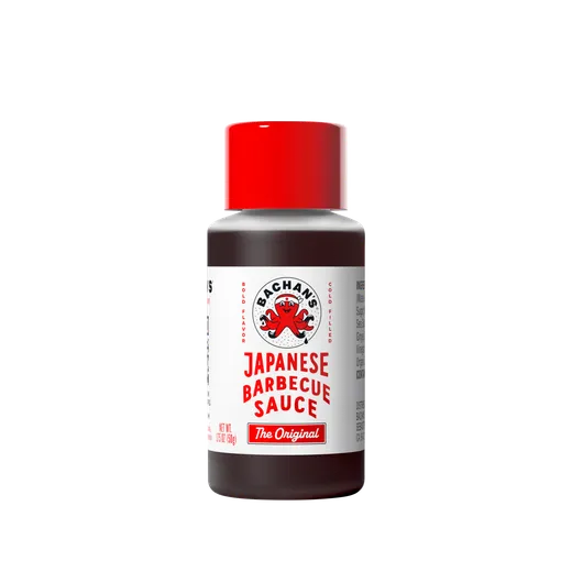 A small bottle of Bachan's Japanese Barbecue Sauce on a black background.