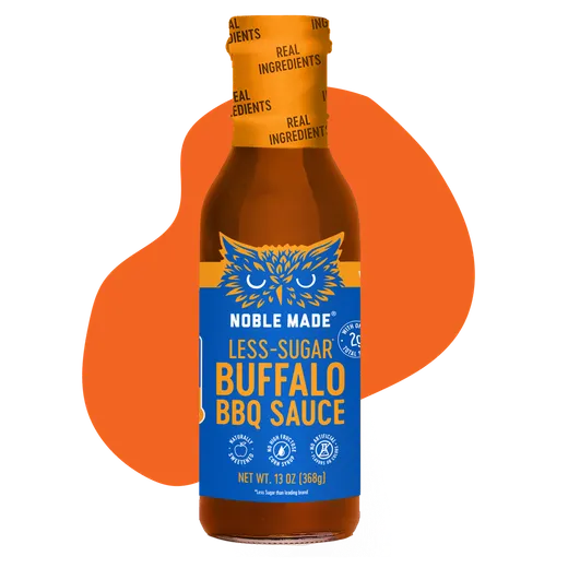 A bottle of Noble Made Less-Sugar Buffalo BBQ Sauce against a solid orange graphic.