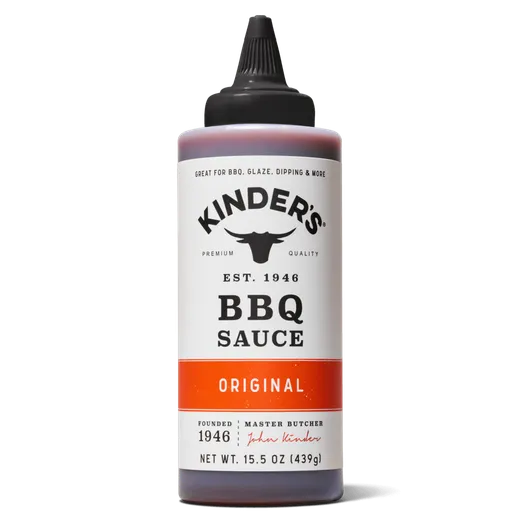 A bottle of Kinder's Original BBQ sauce against a black background.