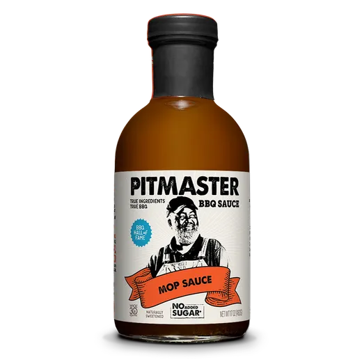 A close-up of a single True Made Foods Pitmaster BBQ Sauce bottle.