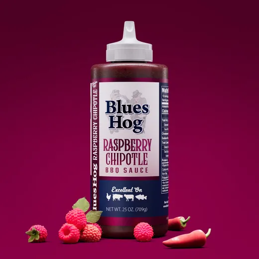 Blues Hog Raspberry Chipotle BBQ sauce bottle with raspberries and chipotle peppers.