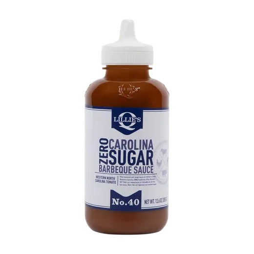 A front view of a bottle of Lillie's Q Zero Sugar Carolina Barbeque Sauce standing on a black background.