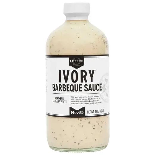 A front view of a bottle of Lillie's Q Ivory Barbeque Sauce against a white background.
