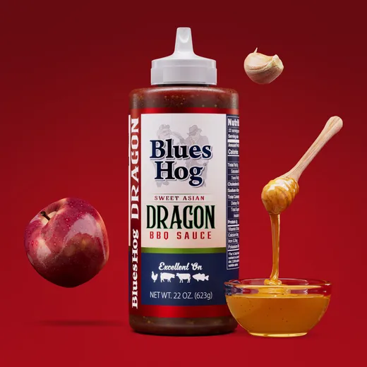 A clean shot of a Blues Hog Sweet Asian Dragon BBQ bottle with floating ingredients.