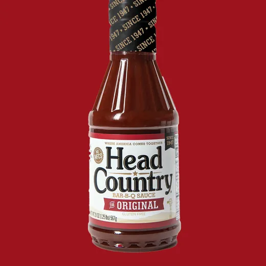A bottle of Head Country Original BBQ Sauce against a red background.
