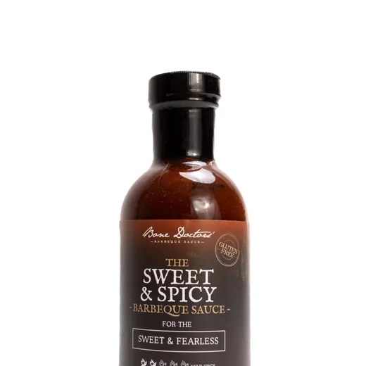 A bottle of Bone Doctors' Sweet & Spicy BBQ Sauce centered against a plain white background.