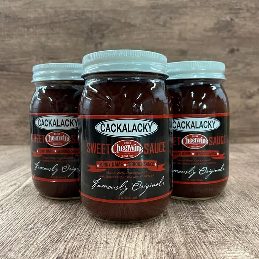 Three jars of Cackalacky sweet Cheerwine BBQ sauce side by side.