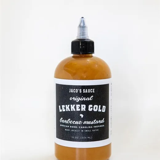 A bottle of Jaco's Sauce Lekker Gold barbecue mustard on a white background.