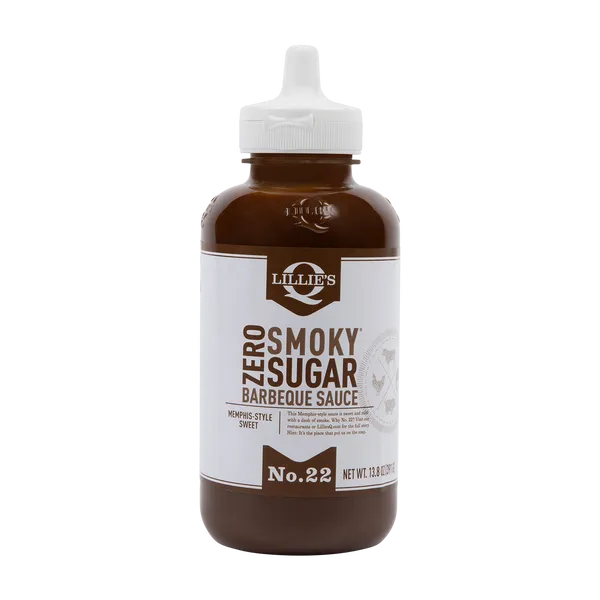 A full bottle of Lillie's Q Zero Sugar Memphis-Style Sweet Barbeque Sauce stands on a black background.