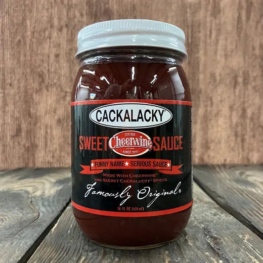 A front-facing view of a jar of Cackalacky Sweet Cheerwine Sauce.