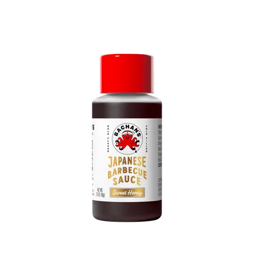 A small bottle of Bachan's Sweet Honey Japanese Barbecue Sauce against a black background.