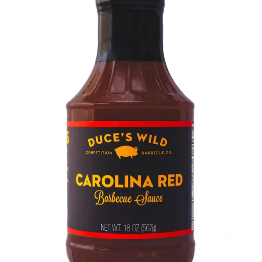 A front-facing view of a bottle of Duce's Wild Carolina Red Barbecue Sauce.